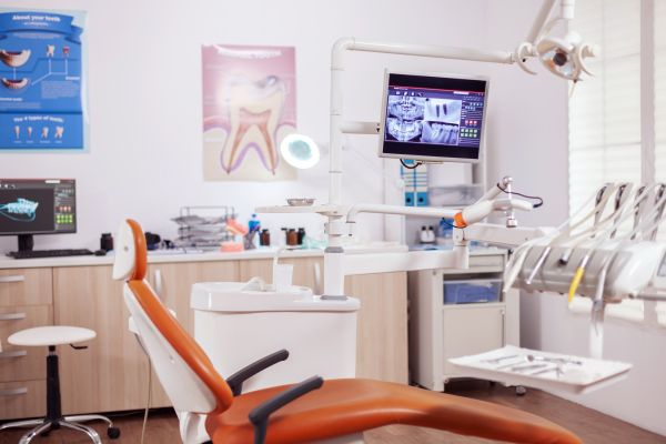 happy young woman in dentist chair