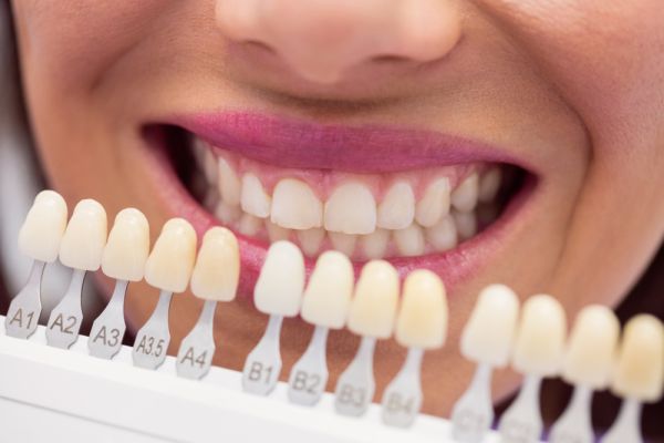 happy young woman in dentist chair